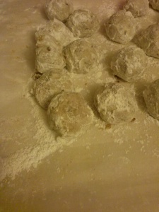 Roll in powdered sugar after baking.